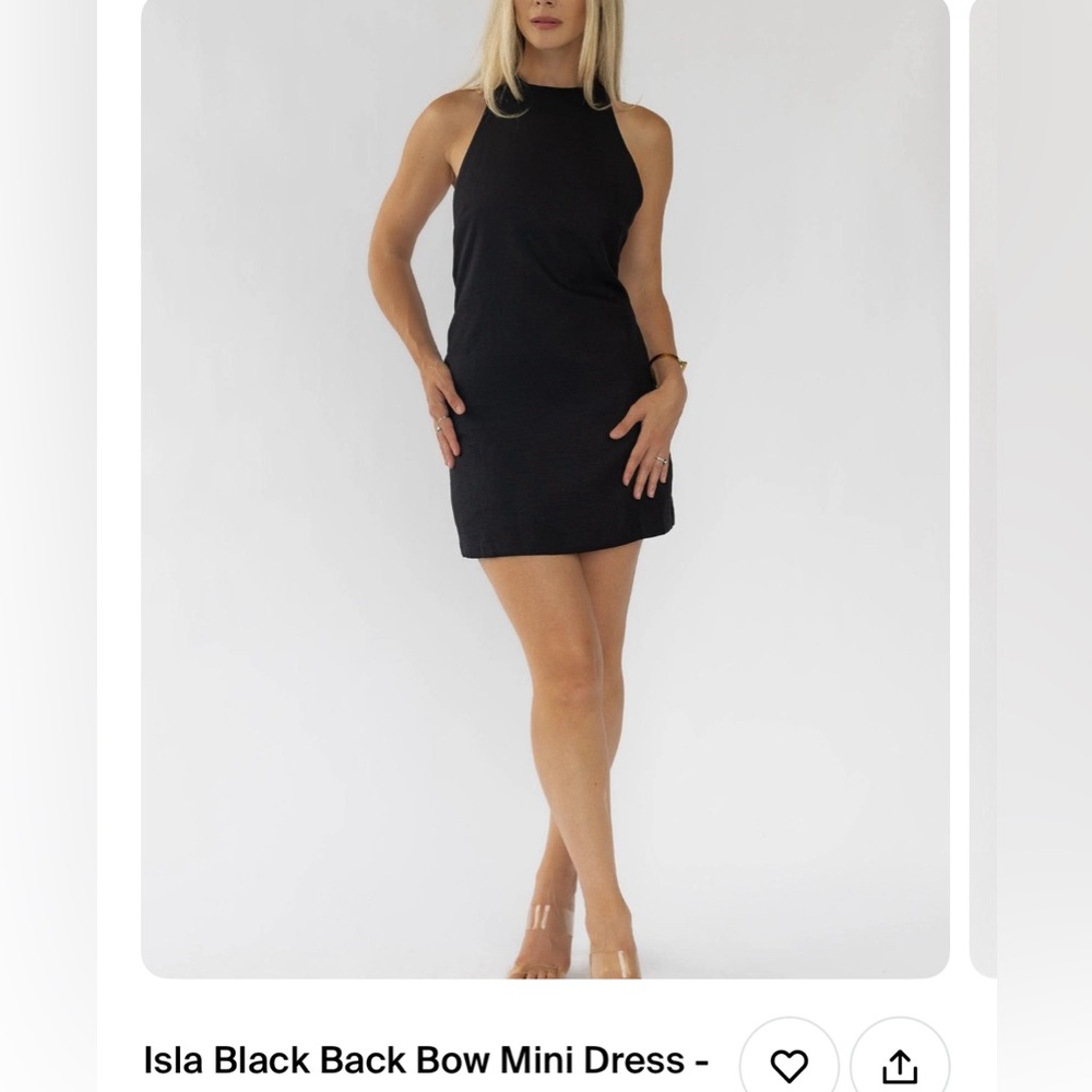 NEW! Little black dress with high halter neckline and bow tie in the back.